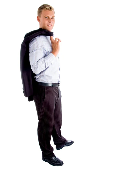 Homem de pé segurando seu casaco — Fotografia de Stock