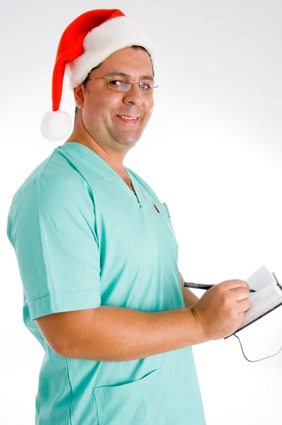 Χαμογελώντας χειρουργός, γράφοντας στο ημερολόγιο — Φωτογραφία Αρχείου
