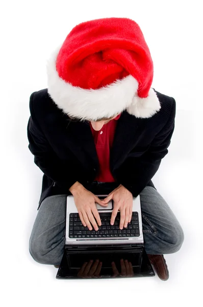 Christmas boy arbetar på bärbar dator — Stockfoto