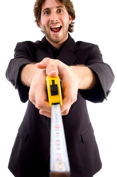 Pleased man showing measuring tape — Stock Photo, Image