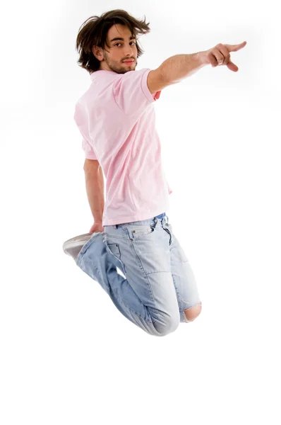 Fashionable guy jumping high in air — Stock Photo, Image