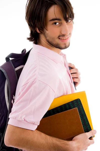 Sonriente universitario posando con su bolso — Foto de Stock