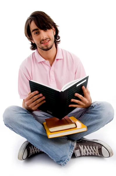 Ung student upptagen med sina böcker — Stockfoto
