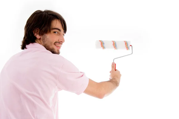 Back pose of man with paint roller — Stock Photo, Image