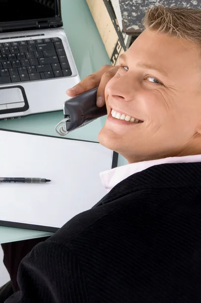 Ceo posing with phone receiver — Stock Photo, Image