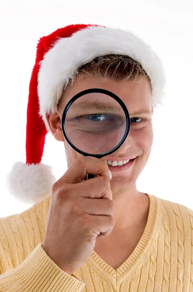 Smiling male looking through lens — Stock Photo, Image