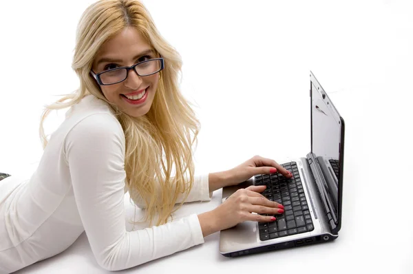 Miling young female working on laptop — Stock Photo, Image