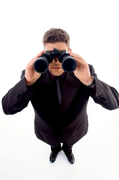 Usinessman with a pair of binoculars — Stock Photo, Image