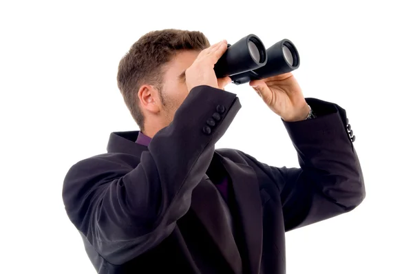Young accountant with binoculars — Stock Photo, Image