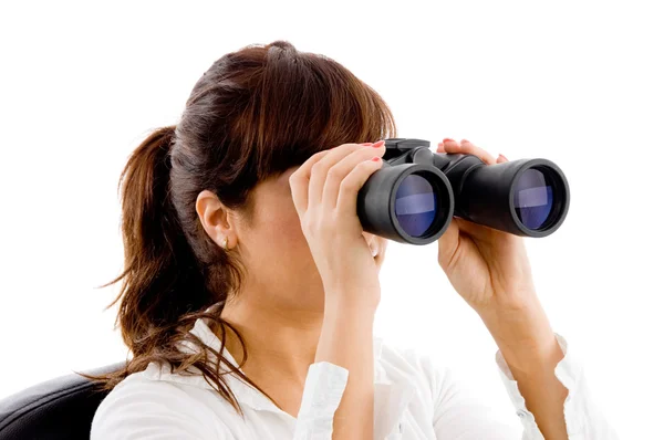 Woman looking through binoculars — Stock Photo, Image