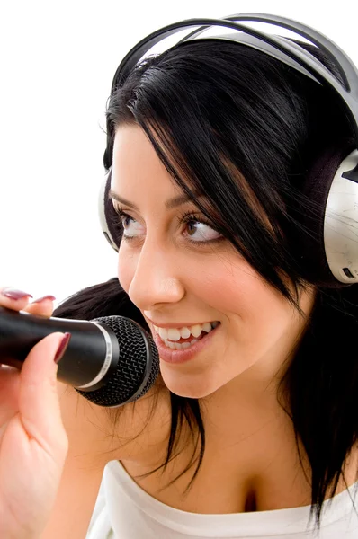 Young female singer enjoying music — Stock Photo, Image
