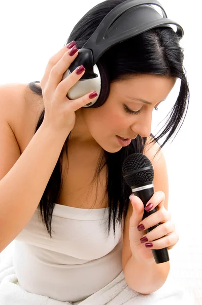 Young female holding headphone and mic — Stock Photo, Image