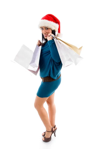Mulher de Natal segurando sacos de compras — Fotografia de Stock