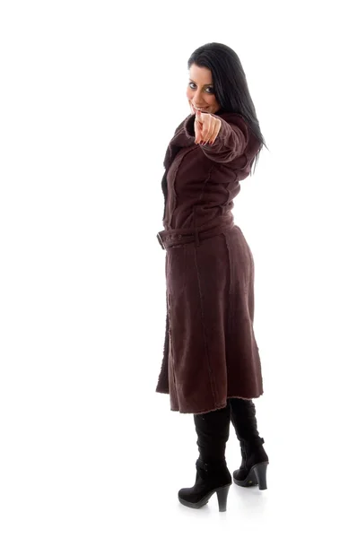 Pointing female wearing overcoat — Stock Photo, Image