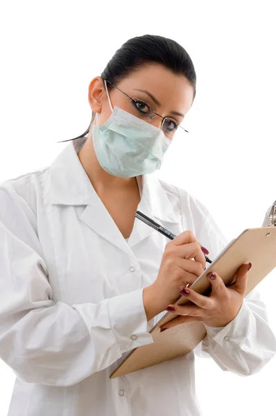 Doutor com almofada de escrita e máscara — Fotografia de Stock