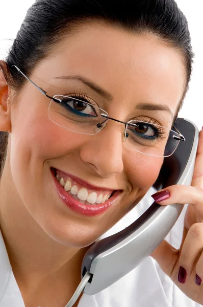 Young female attending call — Stock Photo, Image