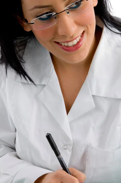 Zadowolony kobiece kobieta lekarz patrzył w bok — Zdjęcie stockowe