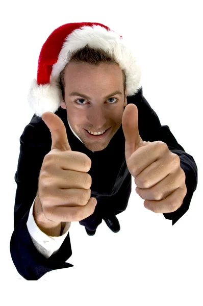 Businessman cheering with santa cap — Stock Photo, Image