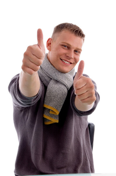 Smiling male showing thumbs up with white background