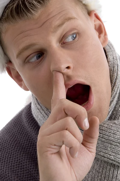 Adam burnunu parmak koyarak — Stok fotoğraf