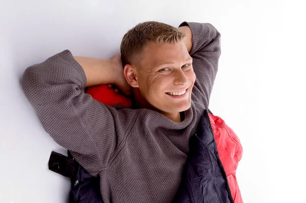 Smiling young guy posing in sleeping bag — Stock Photo, Image