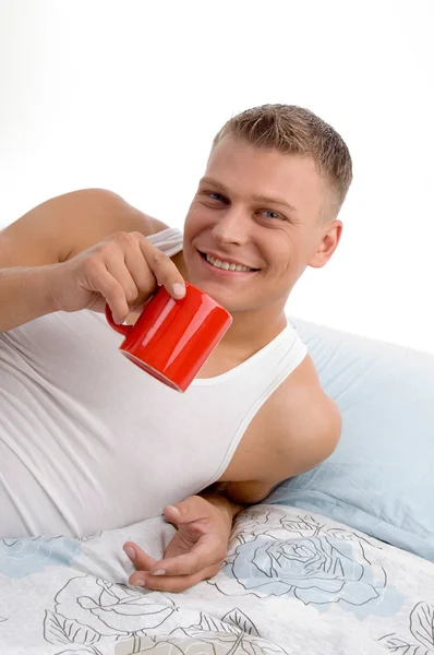 Smiling handsome man drinking coffee — Stock Photo, Image