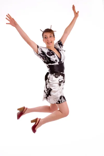 Японская женщина прыгает высоко — стоковое фото