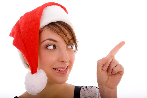 Mulher de chapéu de Natal apontando — Fotografia de Stock