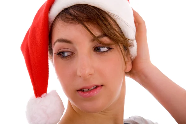 クリスマス帽子横に探している女性 — Stock fotografie