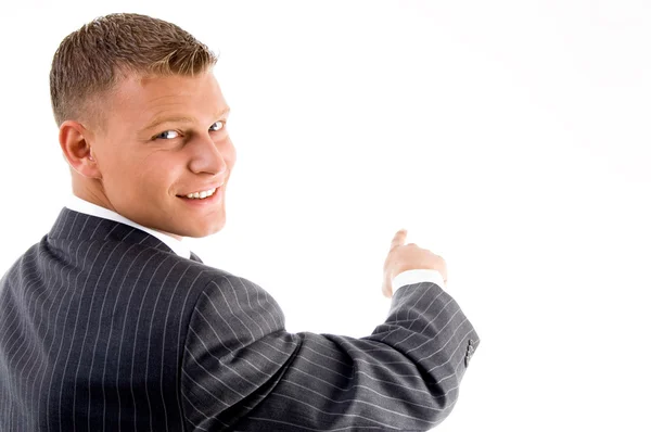 Smiling handsome employee pointing — Stock Photo, Image