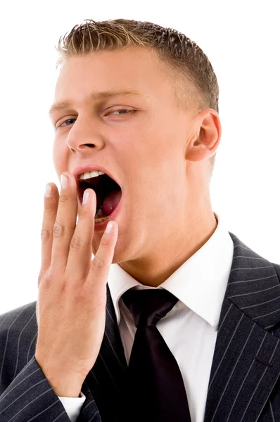 Handsome young manager yawning — Stock Photo, Image
