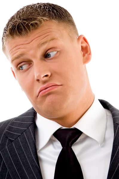 Confused businessman looking aside — Stock Photo, Image