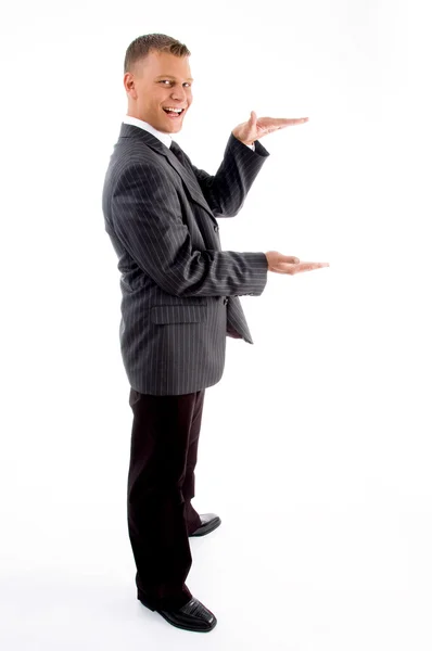 Side pose of standing measuring gesture — Stock Photo, Image