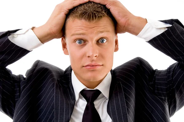 Young executive holding his head — Stock Photo, Image