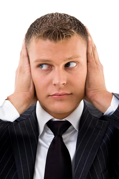 Businessman with hands on his ears — Stock Photo, Image