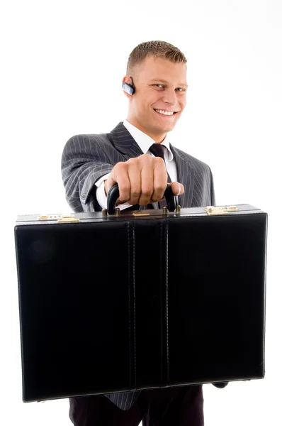 Young corporate showing his briefcase — Stock Photo, Image