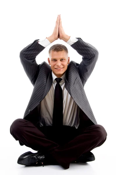 Jovem empresário realizando ioga — Fotografia de Stock