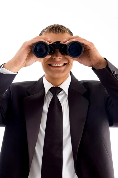 Young executive with binoculars — Stock Photo, Image