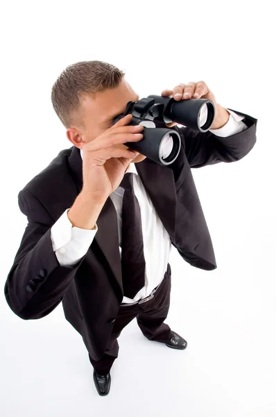 Accountant looking through binoculars — Stock Photo, Image