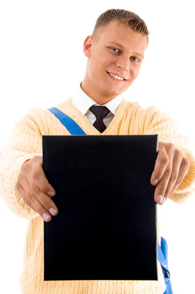 Smiling student showing his book — Stock Photo, Image