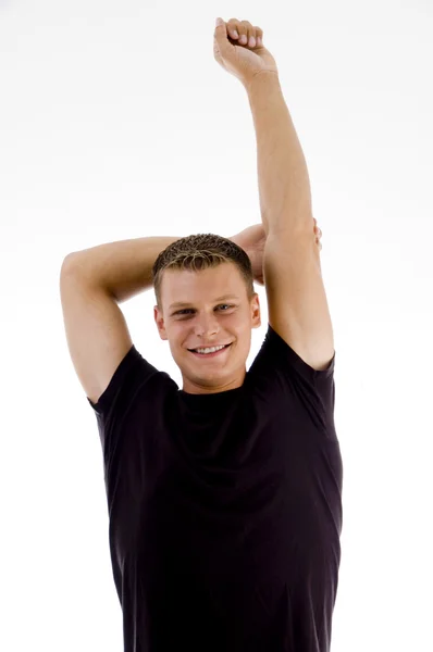 Homem musculoso esticando as mãos — Fotografia de Stock