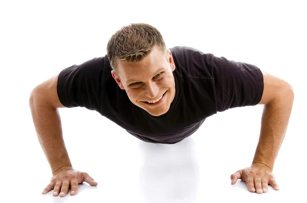 Muscular male doing push ups — Stock Photo, Image