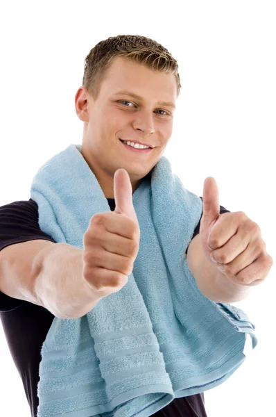 Happy young man with thumbs up — Stock Photo, Image