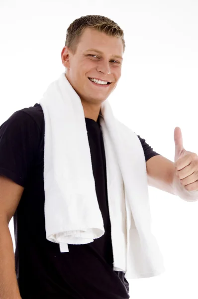 Happy young man showing thumbs up — Stock Photo, Image