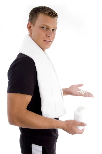 Young man holding medicines — Stock Photo, Image