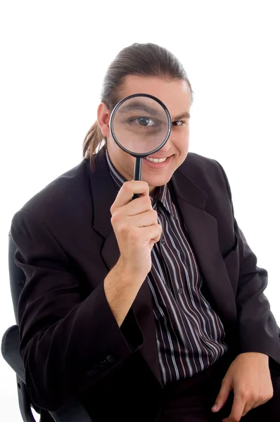 Young investigator holding magnifier — Stock Photo, Image