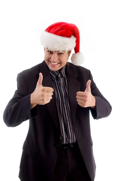 Молодой человек в рождественской шляпе — стоковое фото