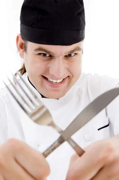 Чоловічий шеф-кухар з ножем і виделкою — стокове фото