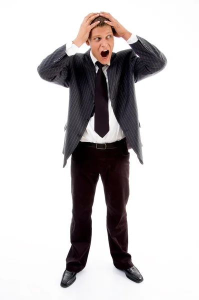 Shocked businessman holding his head Royalty Free Stock Photos