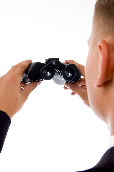 Businessman looking at binoculars — Stock Photo, Image